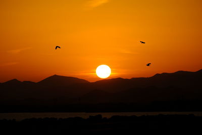 Scenic view of mountains against sky during sunset