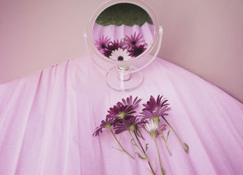 Close-up of wedding dress against wall