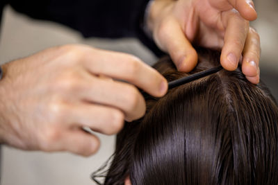 Cropped image of woman holding hair