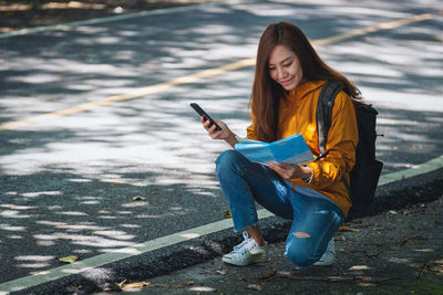 Young woman using mobile phone