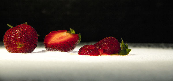 Close-up of strawberries against black background