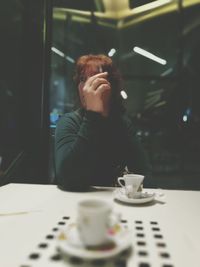 Man sitting on table in cafe