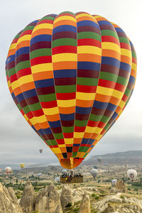 Hot air balloon flies over the city of goreme. cappadocia.