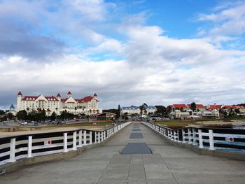 Residential buildings against cloudy sky