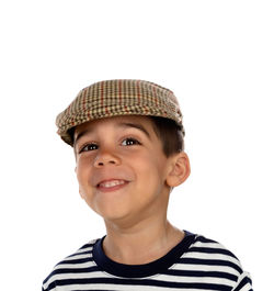 Portrait of smiling boy against white background