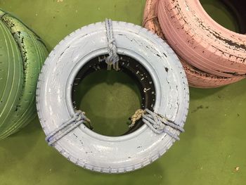 Directly above shot of tied tires on green floor