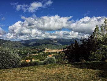 Scenic view of landscape against cloudy sky