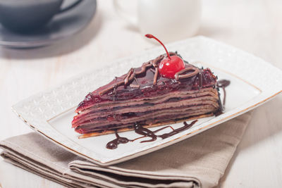 Close-up of chocolate cake in plate on table