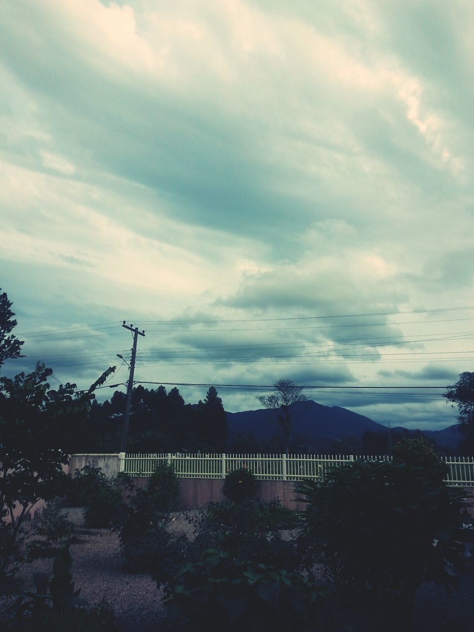 architecture, building exterior, built structure, sky, cloud - sky, tree, cloudy, city, cloud, residential building, residential structure, house, weather, nature, outdoors, no people, connection, building, day, power line