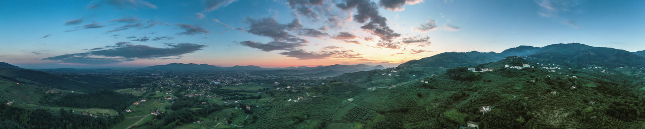 Scenic view of winyards of tuscany against sky during sunset