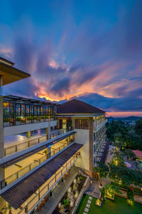 High angle view of illuminated buildings against sky at sunset