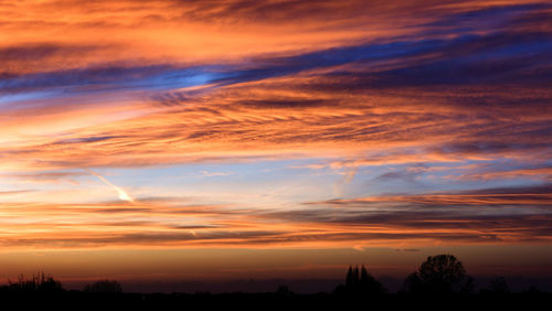 Scenic view of dramatic sky during sunset