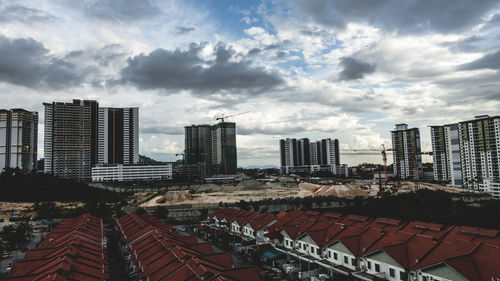 Modern buildings in city against sky