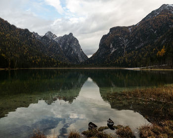 Scenic view of lake and mountains against sky