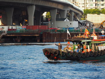 People in boat on river