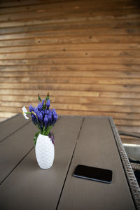 High angle view of purple flower vase on table