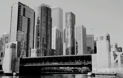 Low angle view of tall buildings against clear sky