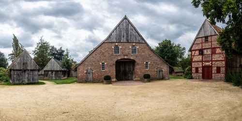 House on field against sky