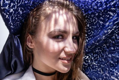 Close-up portrait of a smiling young woman