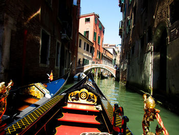 Bridge over canal amidst buildings in city