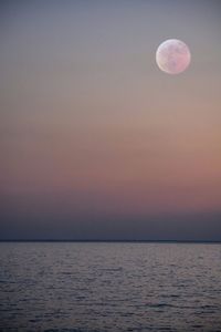 Scenic view of sea against sky at sunset