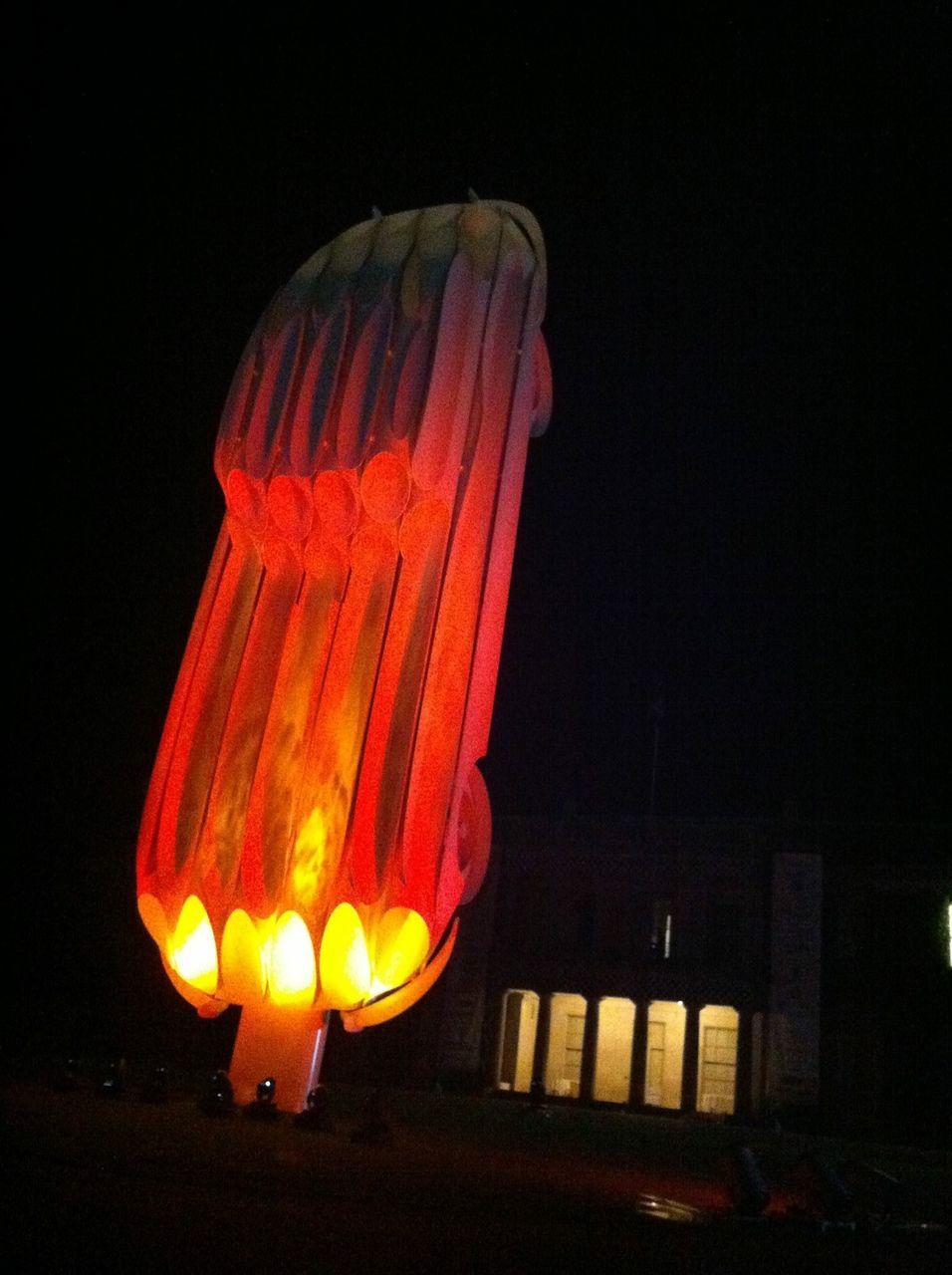 ILLUMINATED LIGHTING EQUIPMENT AGAINST SKY AT NIGHT