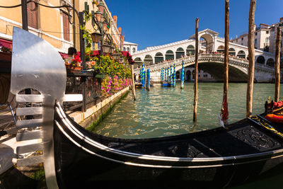 View of boats in canal along buildings