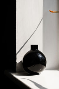 Close-up of vase on table at home
