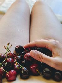 Midsection of woman holding fruits