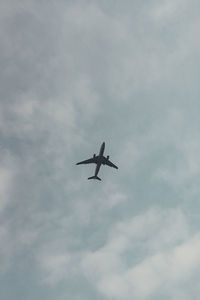 Low angle view of airplane in sky