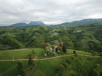 Scenic view of landscape and mountains against sky