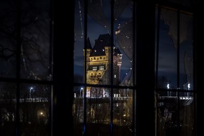 Reflection of illuminated buildings in city at night