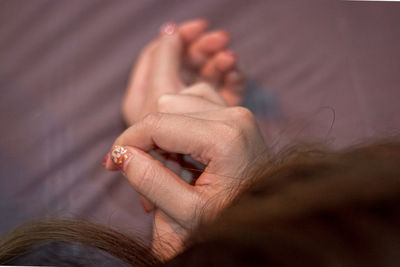 Close-up of woman holding hands