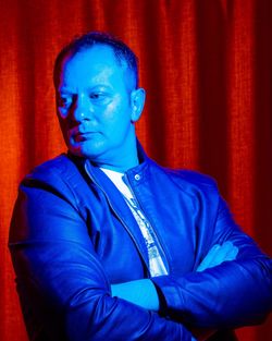 Portrait of a man against blue background