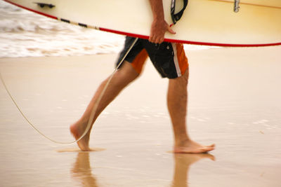 Low section of man at beach