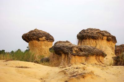 Rock formations in desert against sky