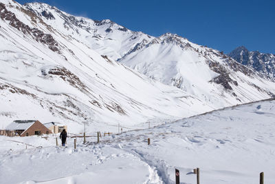 Scenic view of snow covered mountains against sky