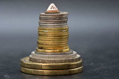 Close-up of coin stack on table