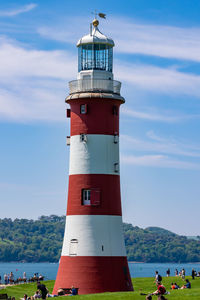 Plymouth hoe lighthouse by sea against sky