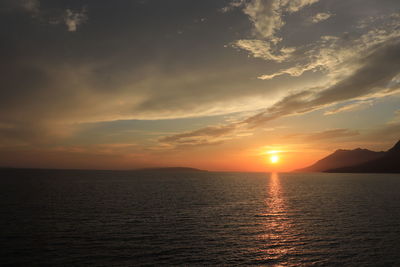 Fabulous sunset reflecting on the waves of the flowing mediterranean sea 