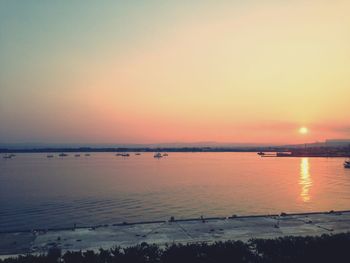 Scenic view of sea at sunset