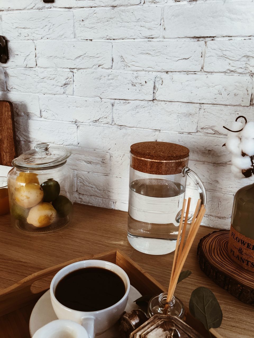 COFFEE CUP ON TABLE AGAINST GLASS