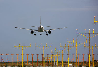 Low angle view of airplane against clear sky