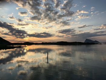 Scenic view of lake against sky during sunset