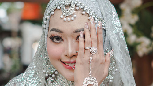 Close-up portrait of woman wearing mask