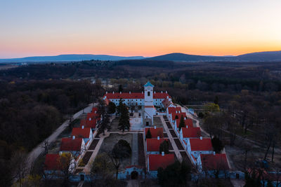 High angle view of buildings in city during sunset