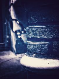 Close-up of old metal stack on table