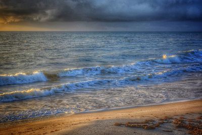 Scenic view of sea against sky during sunset