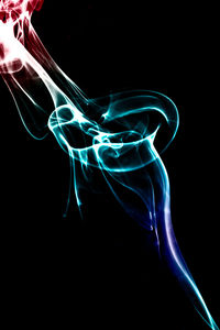 Close-up of light painting against black background