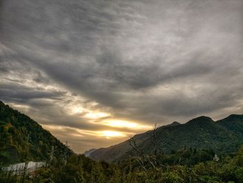 Scenic view of mountains against sky at sunset